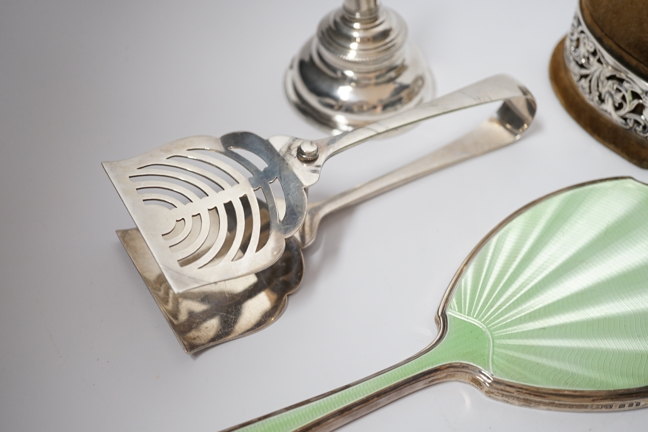 A Georgian silver wine funnel, 11.7cm (a.f.), a pair of silver servers, a pair of Victorian silver sifter spoons, George Adams, London, 1859, a silver and enamel mounted hand mirror and a George V pierced silver mounted